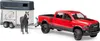 A red toy truck towing a horse trailer with a toy horse. Produktbild-Vorschau