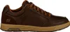 A side view of a brown Skechers sneaker. Voir les images du produit