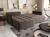 A modern living room with a sectional sofa, coffee table, and artwork. Náhled obrázku produktu