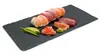 Sushi and sashimi arranged on a dark slate platter with pickled ginger and wasabi. Produktbild-Vorschau