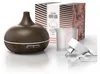 A dark brown aroma diffuser with a wooden design, a measuring cup, and a power adapter, displayed with its packaging in the background. Anteprima dell’immagine prodotto