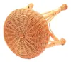 The image shows the underside of a round wicker stool, viewed from a diagonal angle. Náhled obrázku produktu