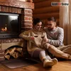 A couple sitting by a fireplace, holding wine glasses. Produktbild-Vorschau