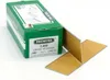 A green cardboard box with product information and a few brads on a white surface. Produktbild-Vorschau