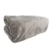 A folded grey blanket on a white background. Produktbild-Vorschau