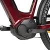 A close-up view of the mid-drive motor and crankset of a red electric bicycle. Produktbild-Vorschau