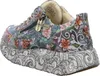 A side view of a single women's sneaker. Produktbild-Vorschau