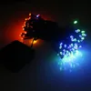 A string of colorful LED lights, some red and orange on the left, and blue and green on the right, connected to a black power source. Produktbild-Vorschau