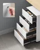 A white rolling filing cabinet with multiple drawers open, revealing office supplies, files, and a hand using a key to lock one of the drawers. Anteprima dell’immagine prodotto