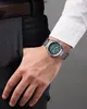 A man's wrist wearing a watch, with his hand in his pocket. Náhled obrázku produktu
