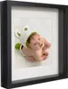 A framed baby photo in a shadow box frame. Náhled obrázku produktu