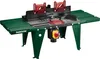 A green and black table-top router machine with red safety guards and a yellow and red power switch, shown against a white background. Produktbild-Vorschau