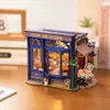 A miniature model of a tea room displayed on a wooden table. Produktbild-Vorschau