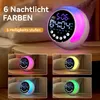A digital alarm clock with a night light feature is displayed on a bedside table, with multiple smaller images showing the clock in different color lighting modes. Produktbild-Vorschau