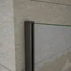 A close-up view of a shower door frame and glass panel against a tiled wall. Produktbild-Vorschau