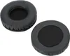Two black headphone ear pads are shown against a white background. Náhled obrázku produktu
