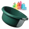 A green plastic basin is shown in the foreground, with a blurred background of various cleaning supplies. Anteprima dell’immagine prodotto