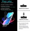 A smartphone with a wireless microphone attached, surrounded by glowing rings, with diagrams of adapters for Android and iPhone. Produktbild-Vorschau