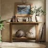 A console table with decorative items and a plant in a hallway setting. Podgląd zdjęcia produktu