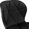 A close-up view of the quilted backrest of a black velvet chair. Náhled obrázku produktu
