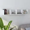A white wall-mounted shelf with various decorative items and books. Produktbild-Vorschau