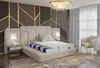 A bedroom scene with a mattress displayed on a bed, showcasing its layers and construction. Produktbild-Vorschau