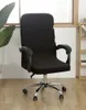 A black office chair cover is shown on an office chair in a room with a wooden floor and a window in the background. Voir les images du produit