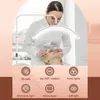 A beautician is performing a procedure on a client's face under a ring light. Produktbild-Vorschau