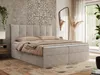 A bedroom scene featuring a large bed with bedding, a mirror, and decorative elements. Produktbild-Vorschau