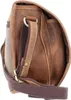 Close-up view of a brown leather bag strap and buckle. Podgląd zdjęcia produktu