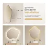 A collage showing an LED bathroom mirror with installation instructions and examples of its illuminated appearance. Podgląd zdjęcia produktu