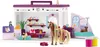 A toy playset depicting a pet grooming salon with various animals and accessories. Produktbild-Vorschau