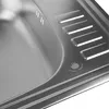 A close-up view of a stainless steel kitchen sink, showing the texture and drainage grooves. Náhľad obrázku produktu