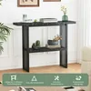 A black console table with a marble-like pattern, decorated with plants and books, in a well-lit room. Produktbild-Vorschau