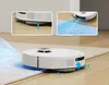 A white robotic vacuum cleaner is shown on a floor, transitioning from hardwood to a rug. Inset images highlight its features. Voir les images du produit