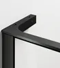 A close-up view of a black metal bracket attached to a white wall, with a glass panel visible. Produktbild-Vorschau