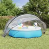 A transparent pool dome covers an inflatable pool in a backyard setting. Náhled obrázku produktu