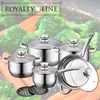 A set of stainless steel cookware is displayed in front of a background of broccoli and carrots. Voir les images du produit