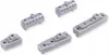 Several small gray plastic model ships and engine blocks are arranged on a white background. Produktbild-Vorschau