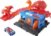 A toy car playset featuring a red monster and a blue car. Voir les images du produit