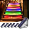 Solar-powered LED lights illuminating outdoor stairs with a rainbow effect, with individual lights shown in the foreground. Produktbild-Vorschau