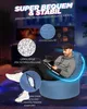 A man sitting on a blue beanbag chair in a dimly lit room with gaming equipment in the background. Produktbild-Vorschau