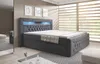 A modern bedroom with a large upholstered bed as the focal point, featuring integrated LED lighting. Produktbild-Vorschau
