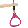 A close-up shot of a pink trapezoid swing handle attached to a rope, which is suspended from a wooden bar. Anteprima dell’immagine prodotto