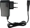 A black power adapter with a cord and plug. Produktbild-Vorschau