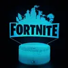 A Fortnite Battle Royale LED 3D night light with a remote control, displayed against a black background. Voir les images du produit