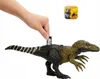 A hand is inserting a small card into a slot on the back of a dinosaur toy. A small square graphic with dinosaur images is also visible. Náhľad obrázku produktu