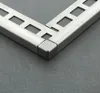 A close-up view of a metal corner piece connecting two lengths of metal trim, likely for flooring or tiling. Produktbild-Vorschau