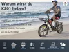 A man riding an e-bike on a beach. Produktbild-Vorschau