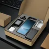 A product set including a smartphone, chargers, and earphones neatly arranged in a cardboard box with foam inserts, placed on a dark surface. Produktbild-Vorschau